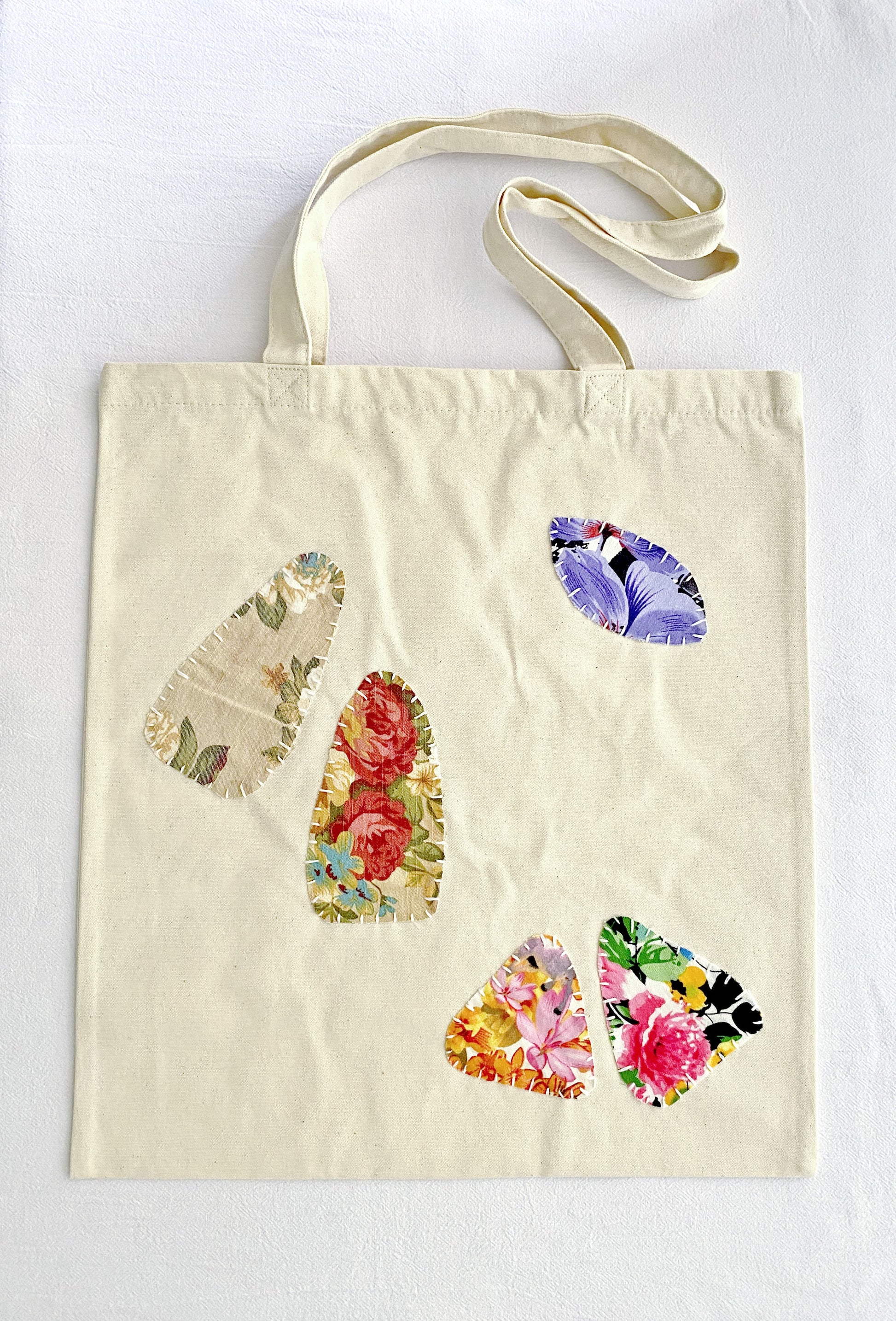 sustainable women’s canvas tote with hand-crafted patchwork design accents