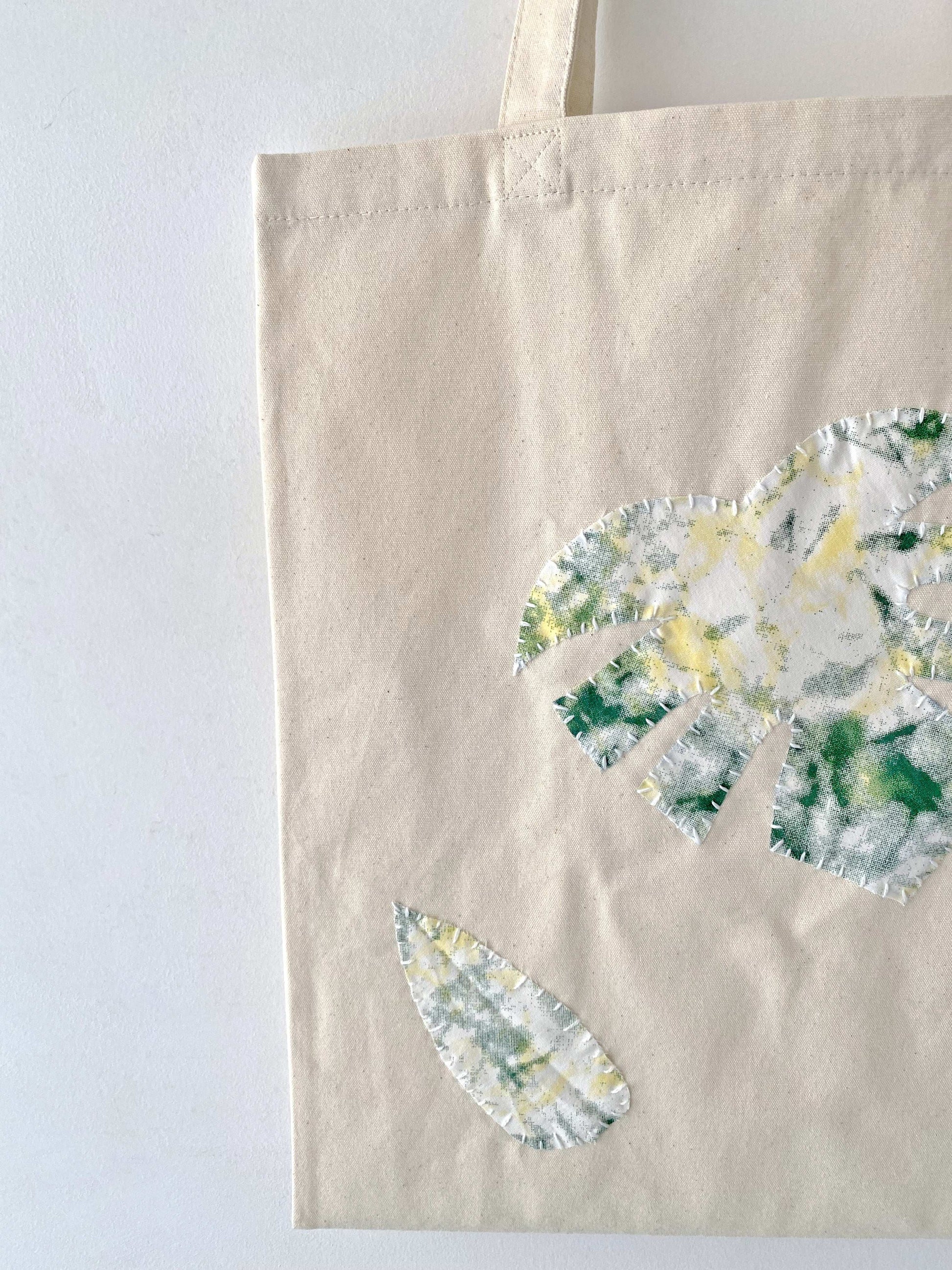 Green botanical patch stitched tote