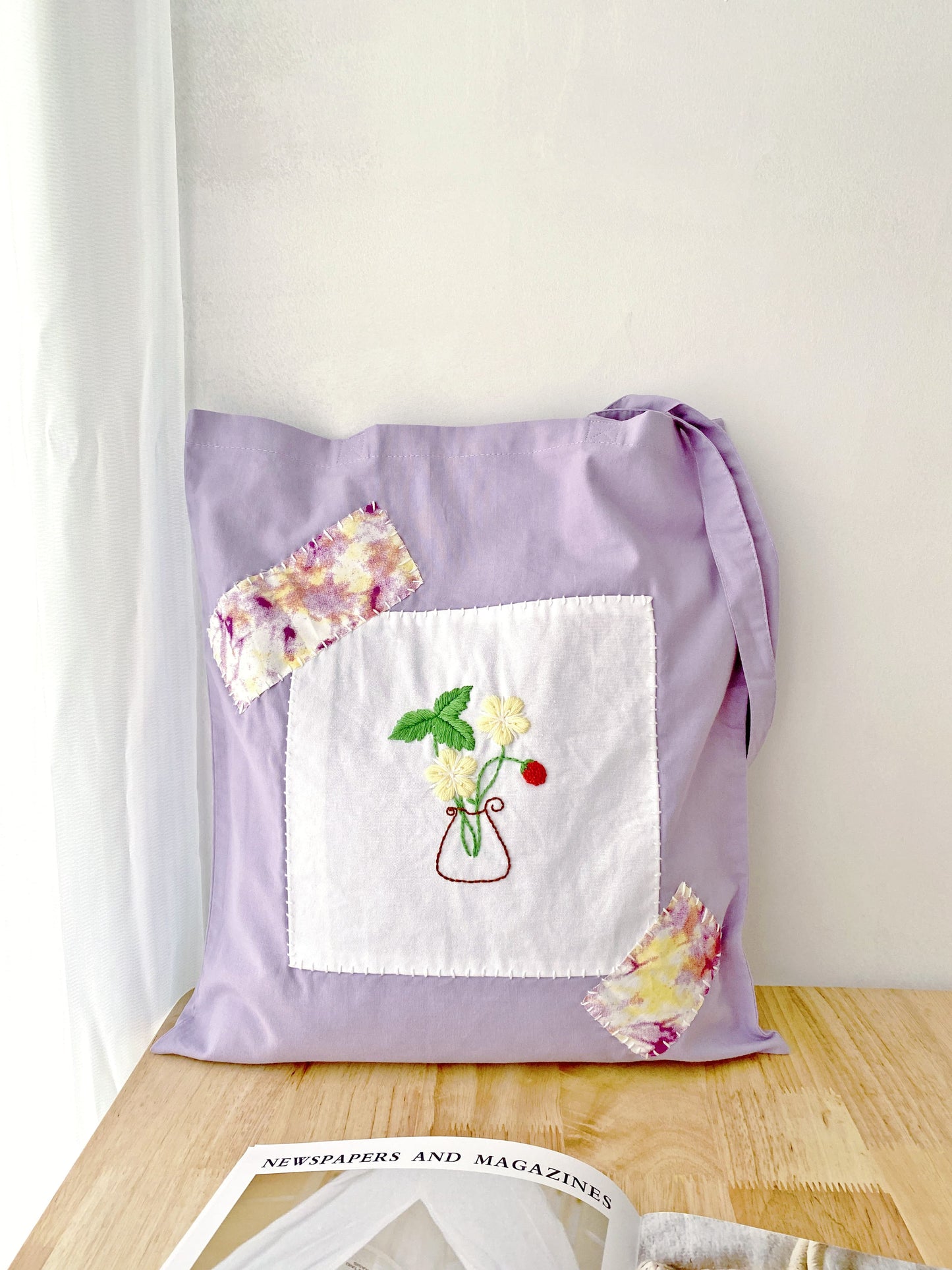 natural material shoulder bag with elegant embroidered flower pattern