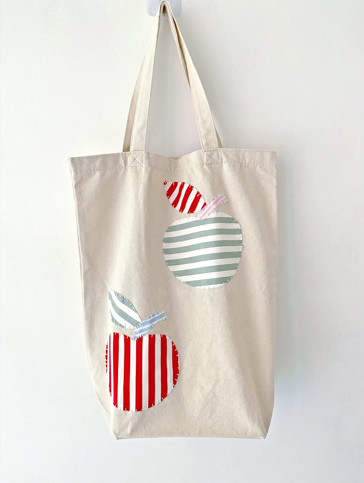 Roomy tote with natural materials and sewn patterns, ideal for graduation gifts with a personal flair