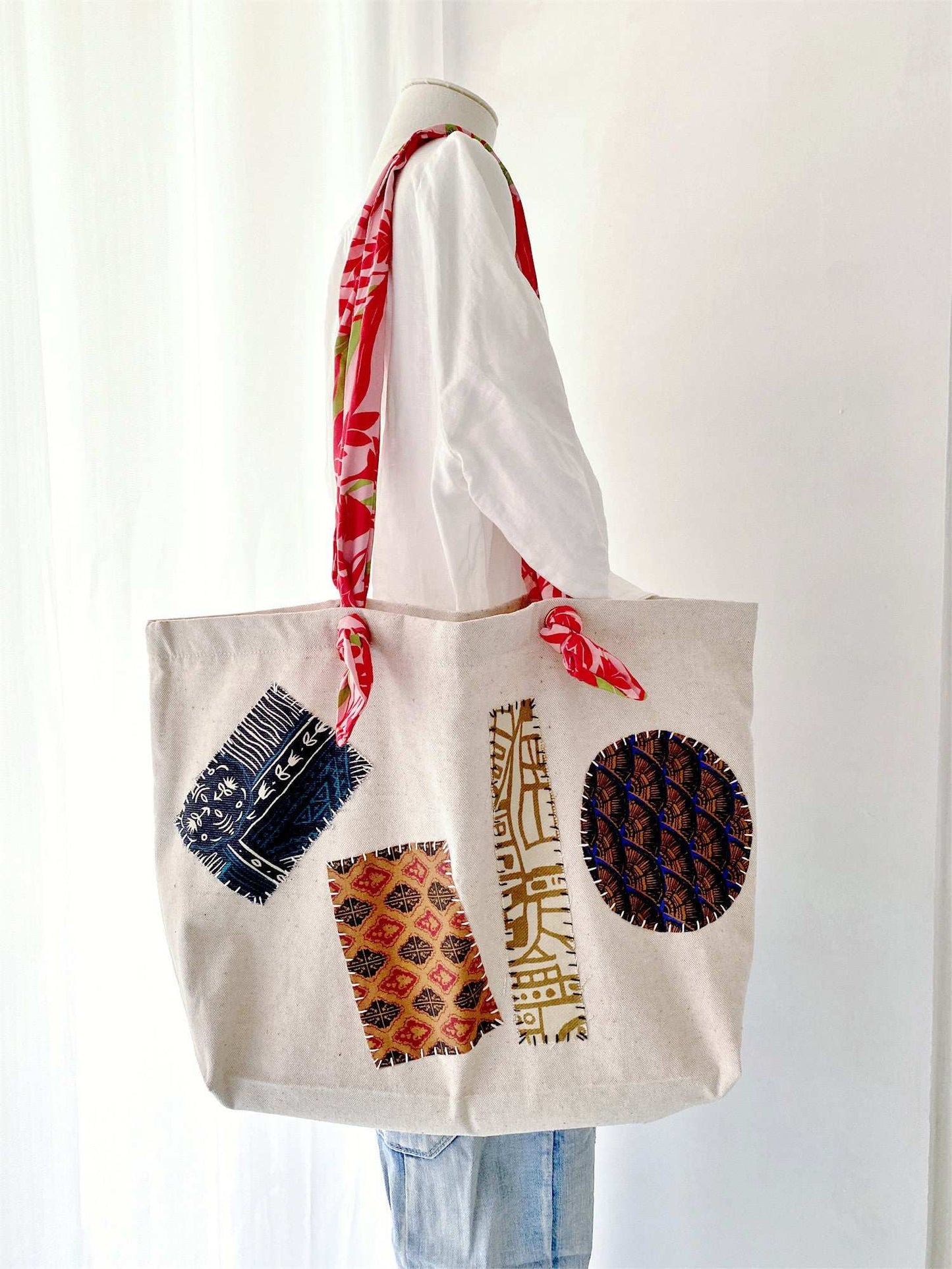 Sustainable cotton linen tote bag for women, highlighting hand-stitched motifs ideal for mindful wardrobe additions