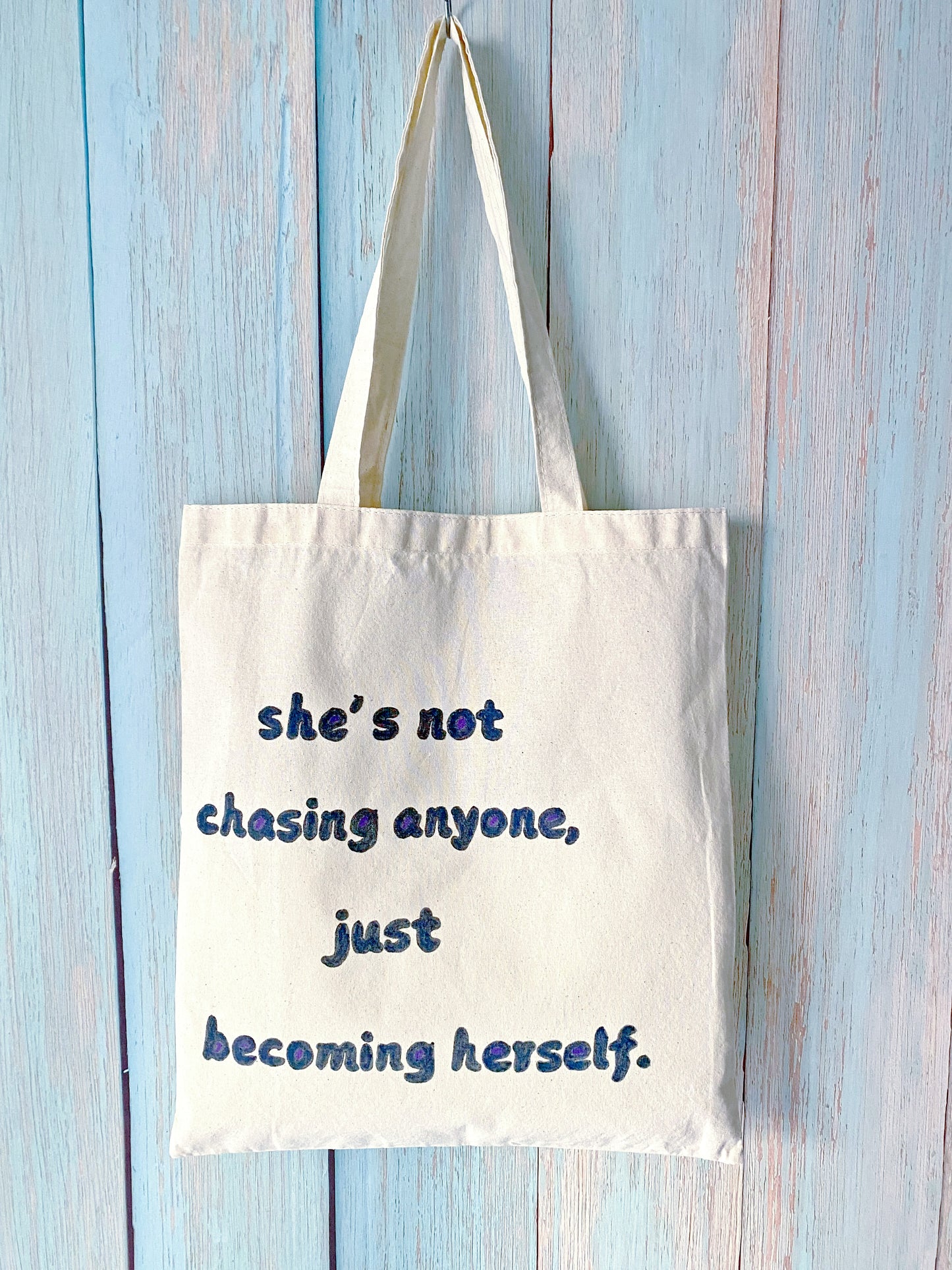 Large-capacity cotton bag with a hand-painted inspirational English short phrase, ideal for shopping and errands.
