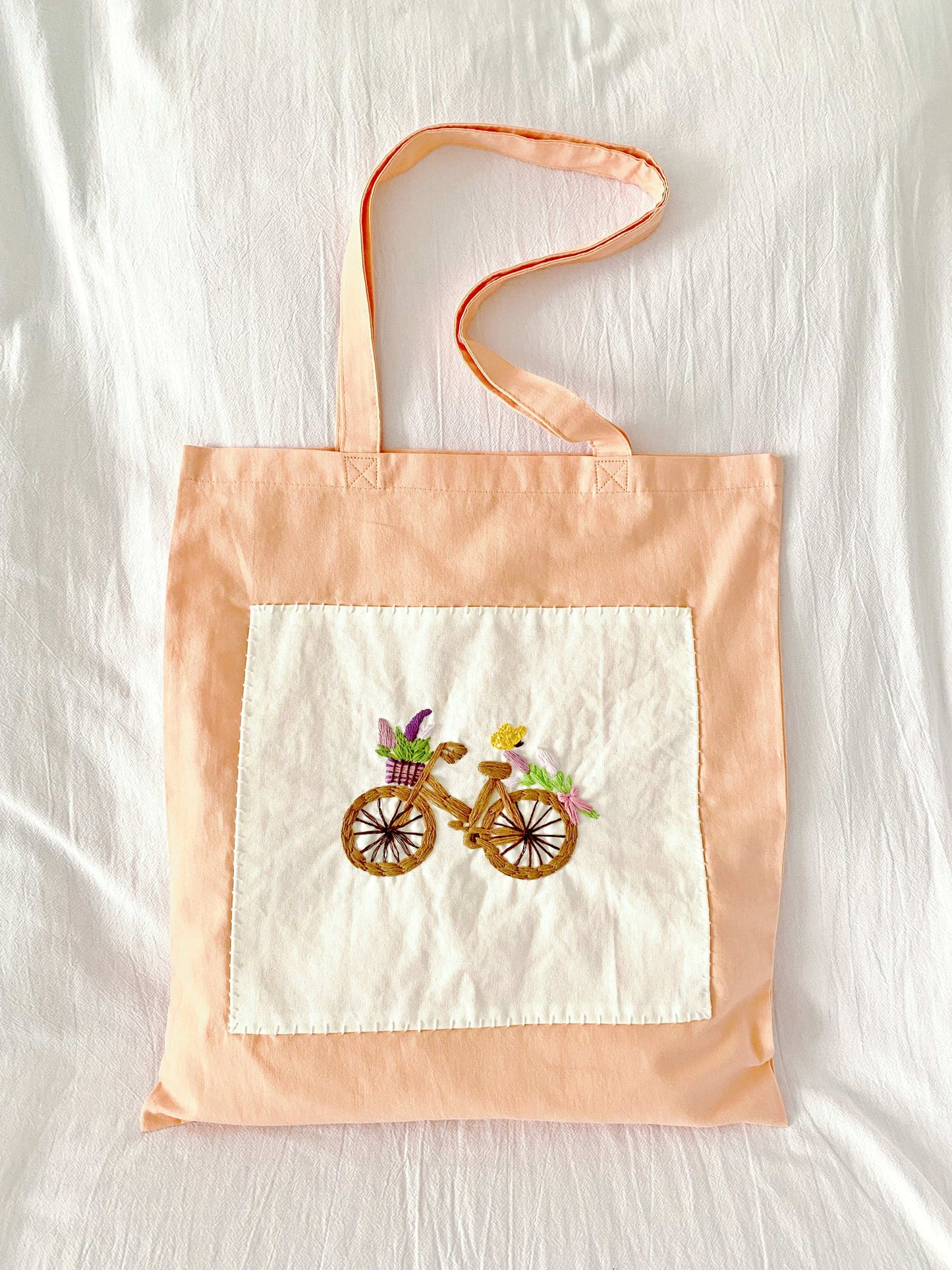 elegant embroidered shoulder tote with bicycle design