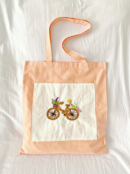 elegant embroidered shoulder tote with bicycle design