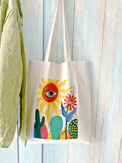 Durable large-capacity cotton bag featuring an artistic cactus sun design, suitable for everyday carry or thoughtful gifting.