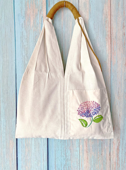 Creative embroidered flower tote made from durable eco canvas, perfect for minimalist lifestyles and thoughtful handmade gifts.