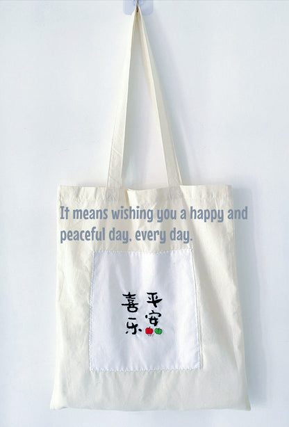 sustainable cotton tote with hand embroidered creative designs