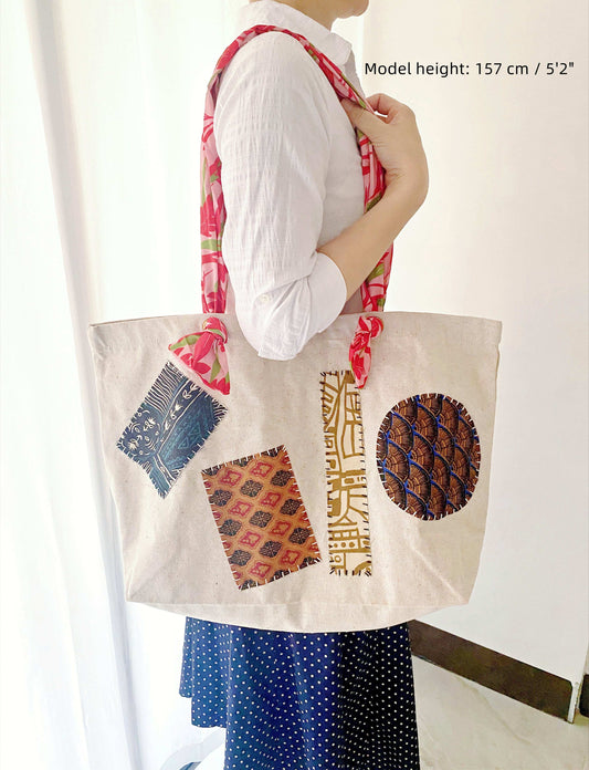 Durable shoulder bag made from sustainable materials featuring unique hand-sewn fabric patterns for slow living enthusiasts