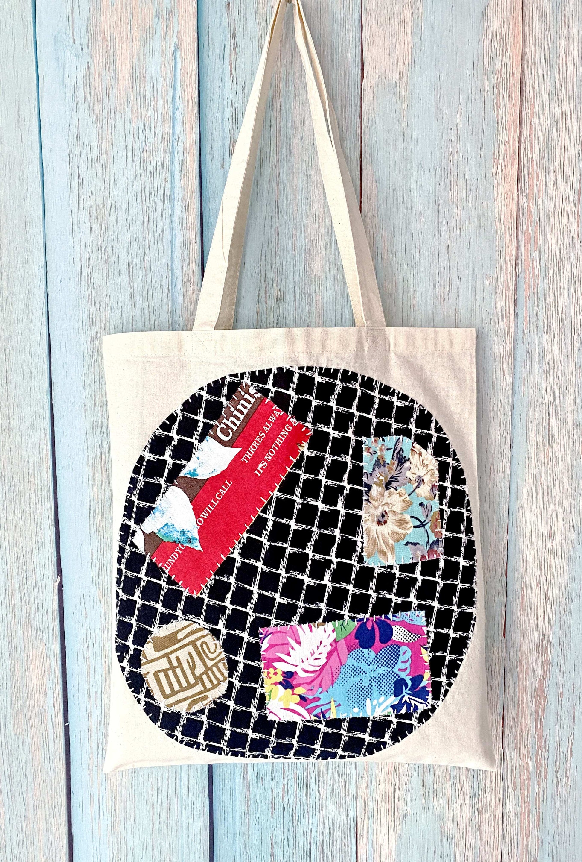 Eco canvas shoulder bag with hand-stitched patchwork art for casual daily use