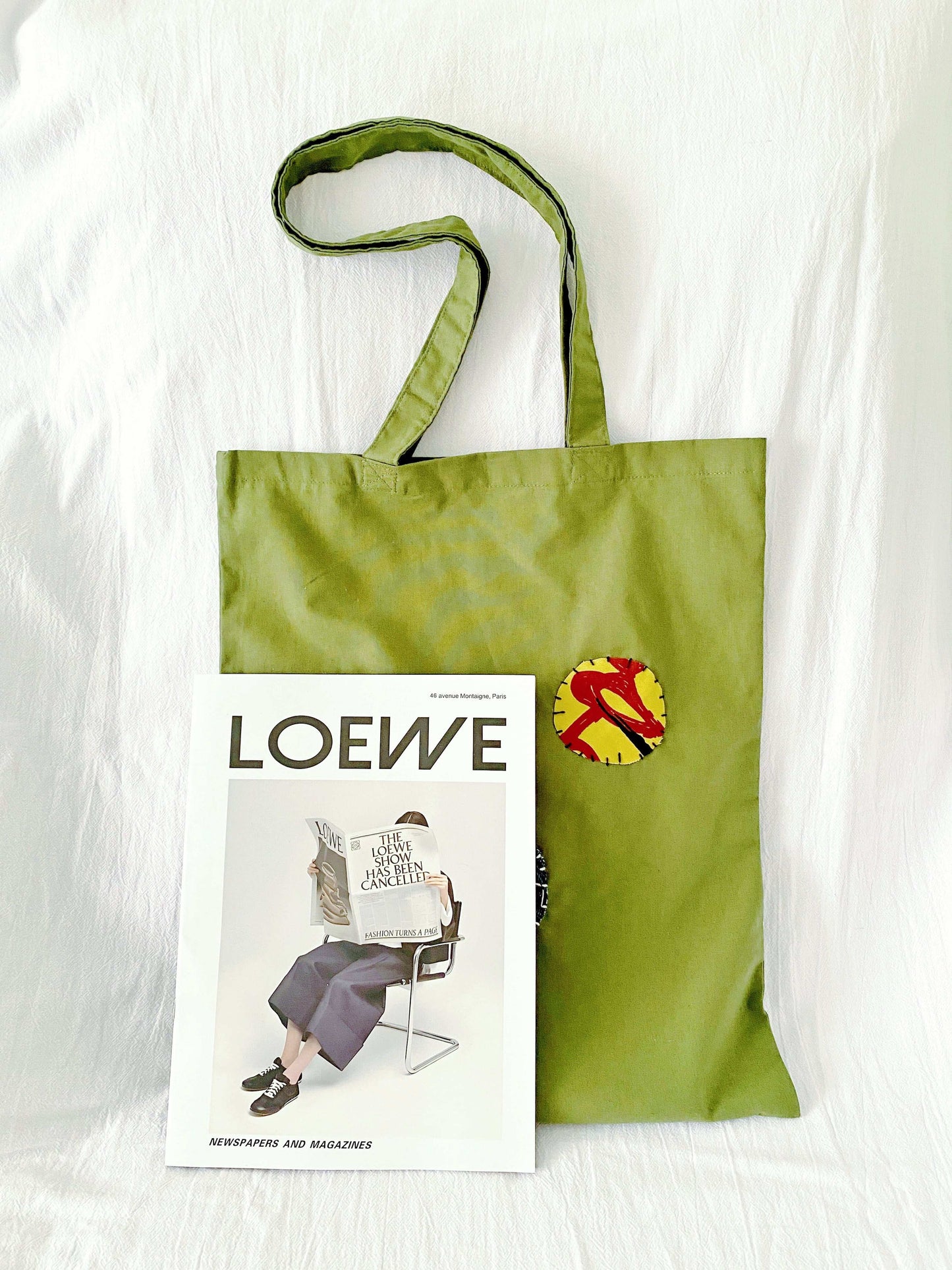 Durable tote with hand-stitched motifs, perfect for minimalist wardrobes and daily errands
