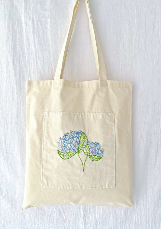 Stylish slow-fashion tote with artisanal embroidered flowers