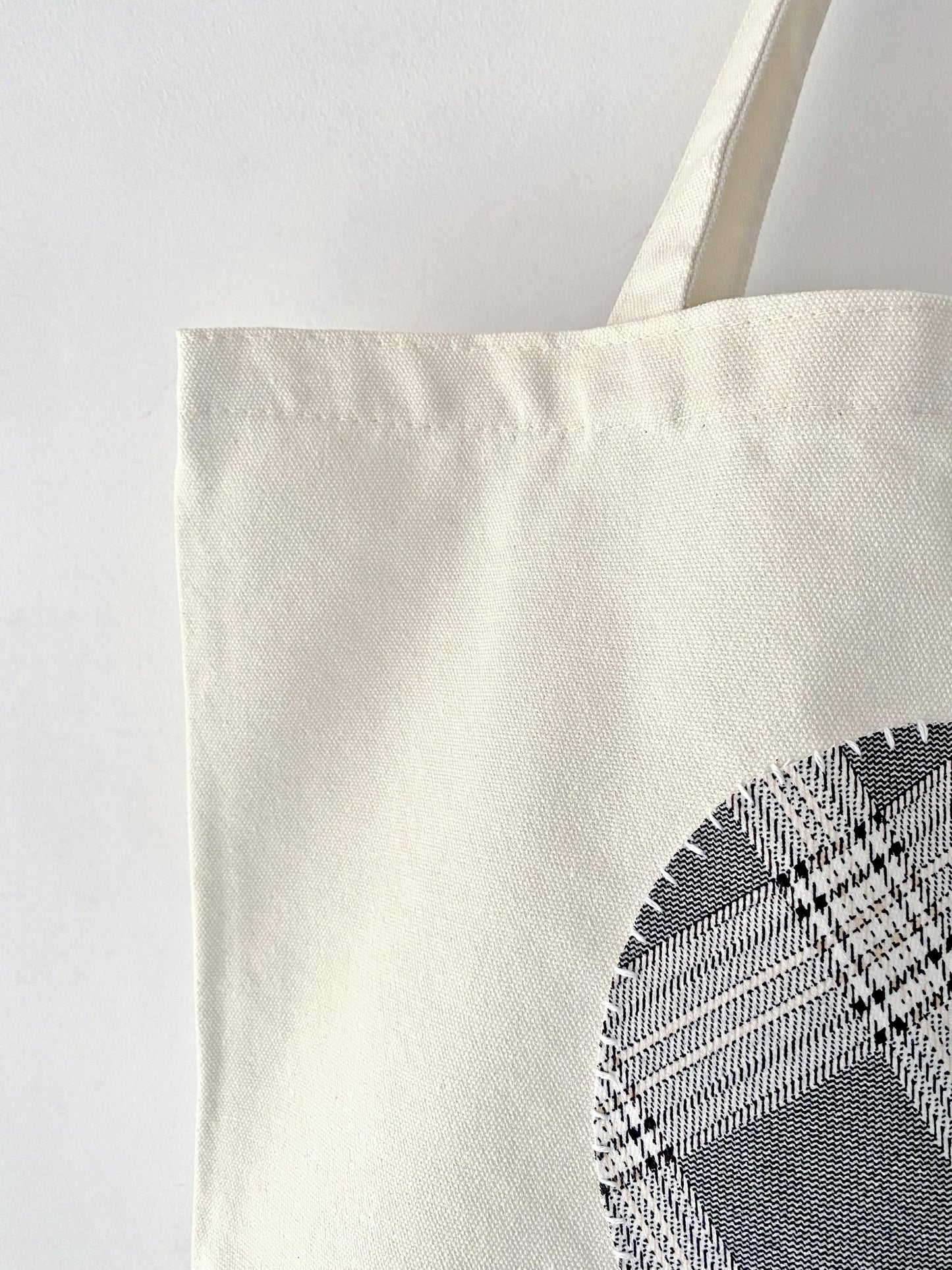 Women’s casual canvas tote with eco-conscious handmade patchwork design