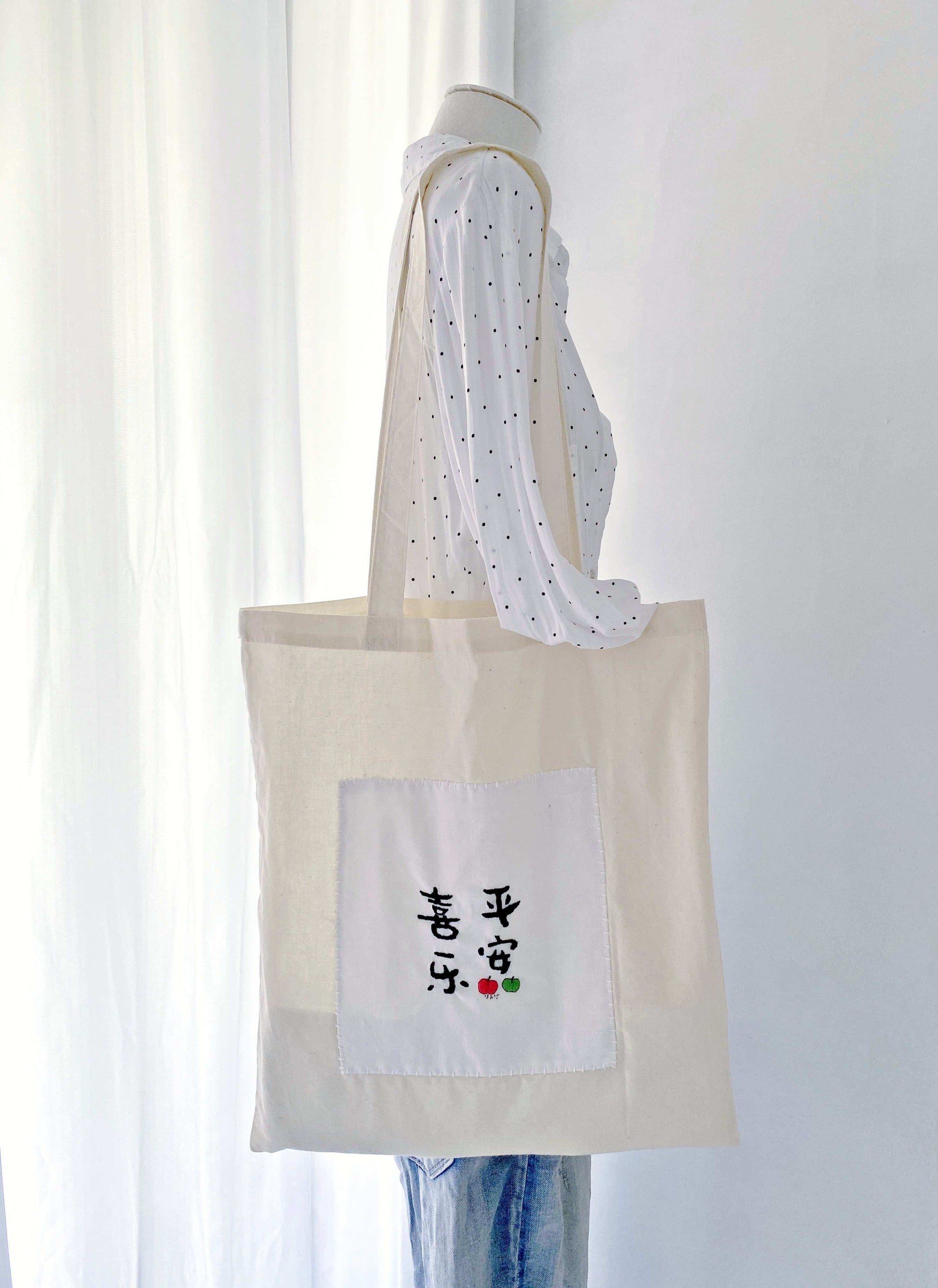 oversized soft tote with hand embroidered playful motifs