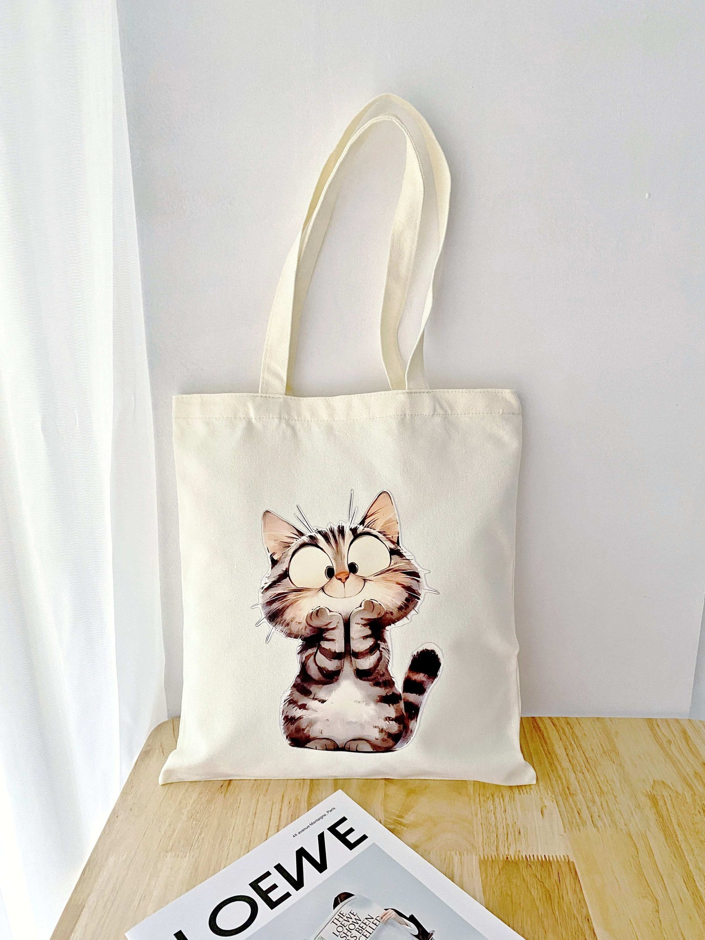 sustainable fashion tote with creative cat artwork