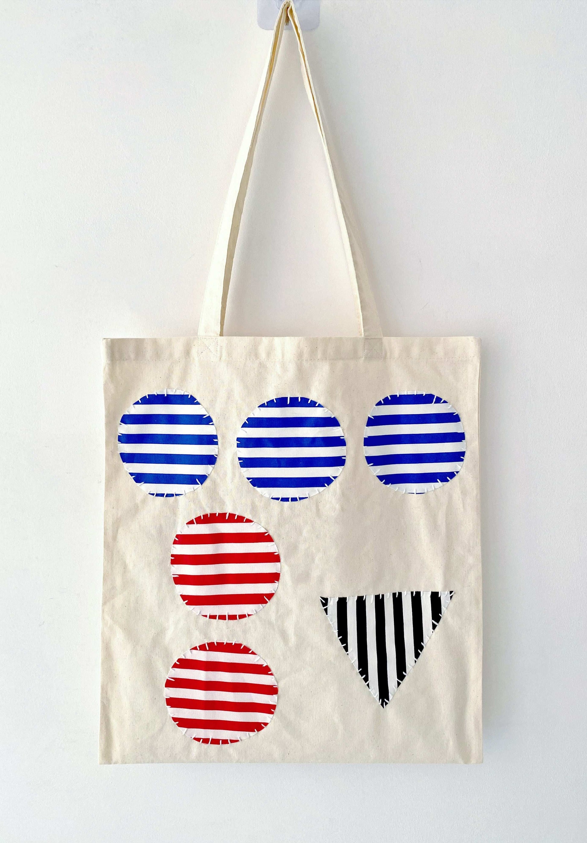 Simple yet durable bag featuring artisanal patchwork accents