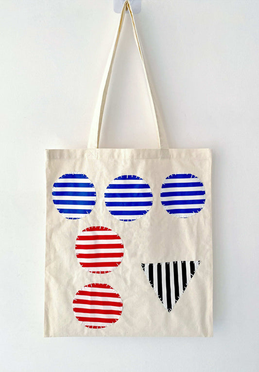 Simple yet durable bag featuring artisanal patchwork accents