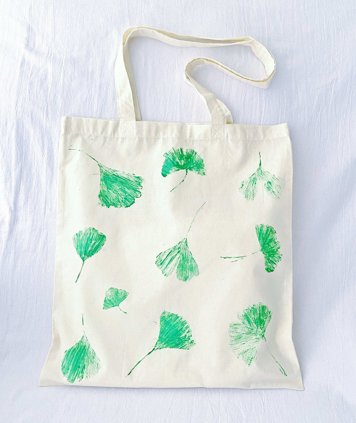 feminine eco tote with printed leaf illustration