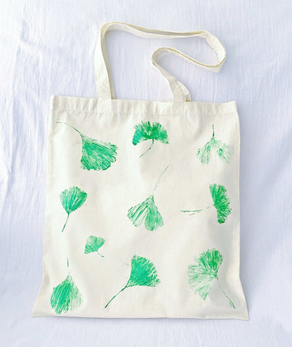 feminine eco tote with printed leaf illustration