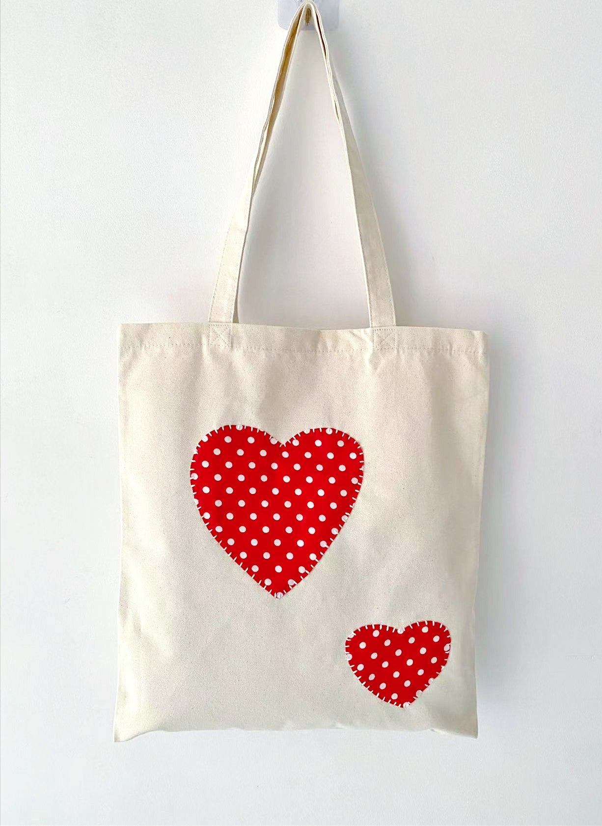 Minimalist canvas tote featuring unique handcrafted fabric accents