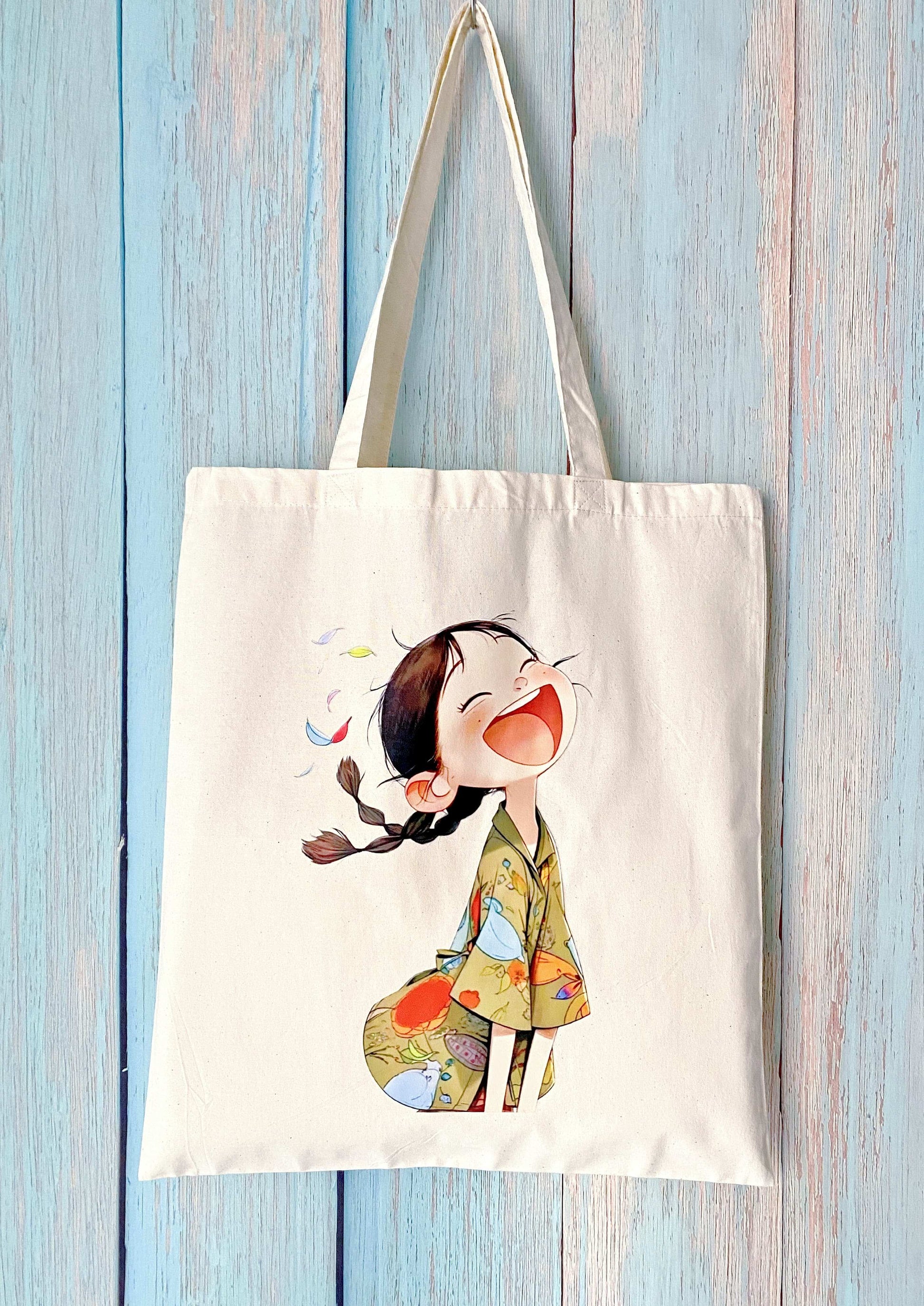 A minimalist eco cotton tote bag with a hand-printed happy girl design, ideal for slow living and everyday use