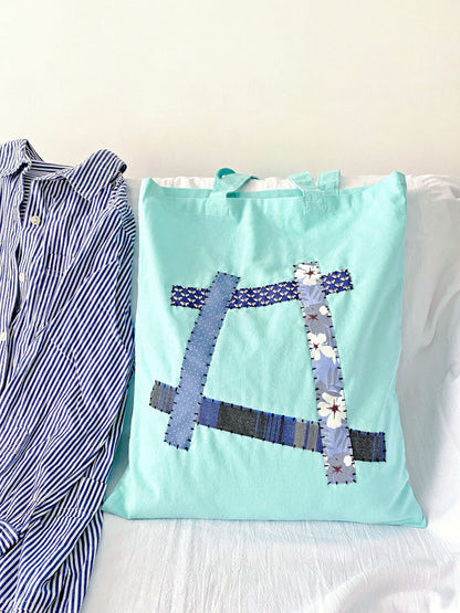 Durable lightweight tote bag showcasing artistic hand-sewn patterns in sustainable fabric