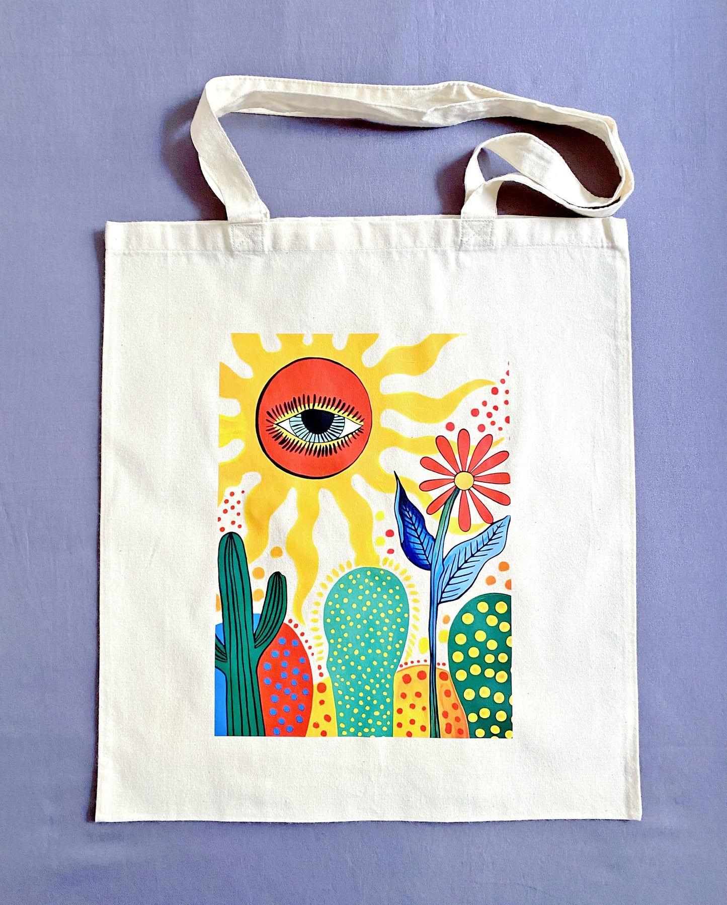 Eco-conscious large capacity cotton tote bag featuring a unique cactus sun illustration