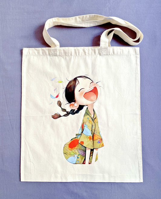 Sustainable natural fabric tote bag with a handmade print of a smiling girl, great for weekend shopping or travel.