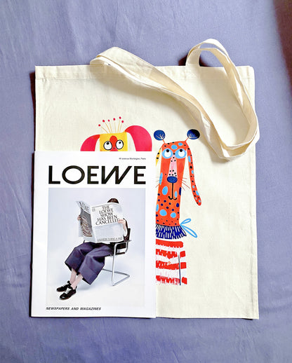 Sustainable fabric tote with hand-printed puppy artwork, perfect for pet lovers
