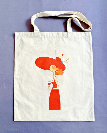 Soft and lightweight sustainable cotton shoulder bag featuring artistic woman with wine design