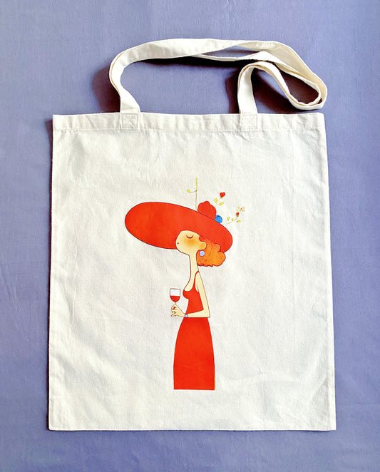 Soft and lightweight sustainable cotton shoulder bag featuring artistic woman with wine design
