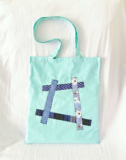 Large capacity cotton shoulder bag with a bohemian vibe from intricate patchwork details
