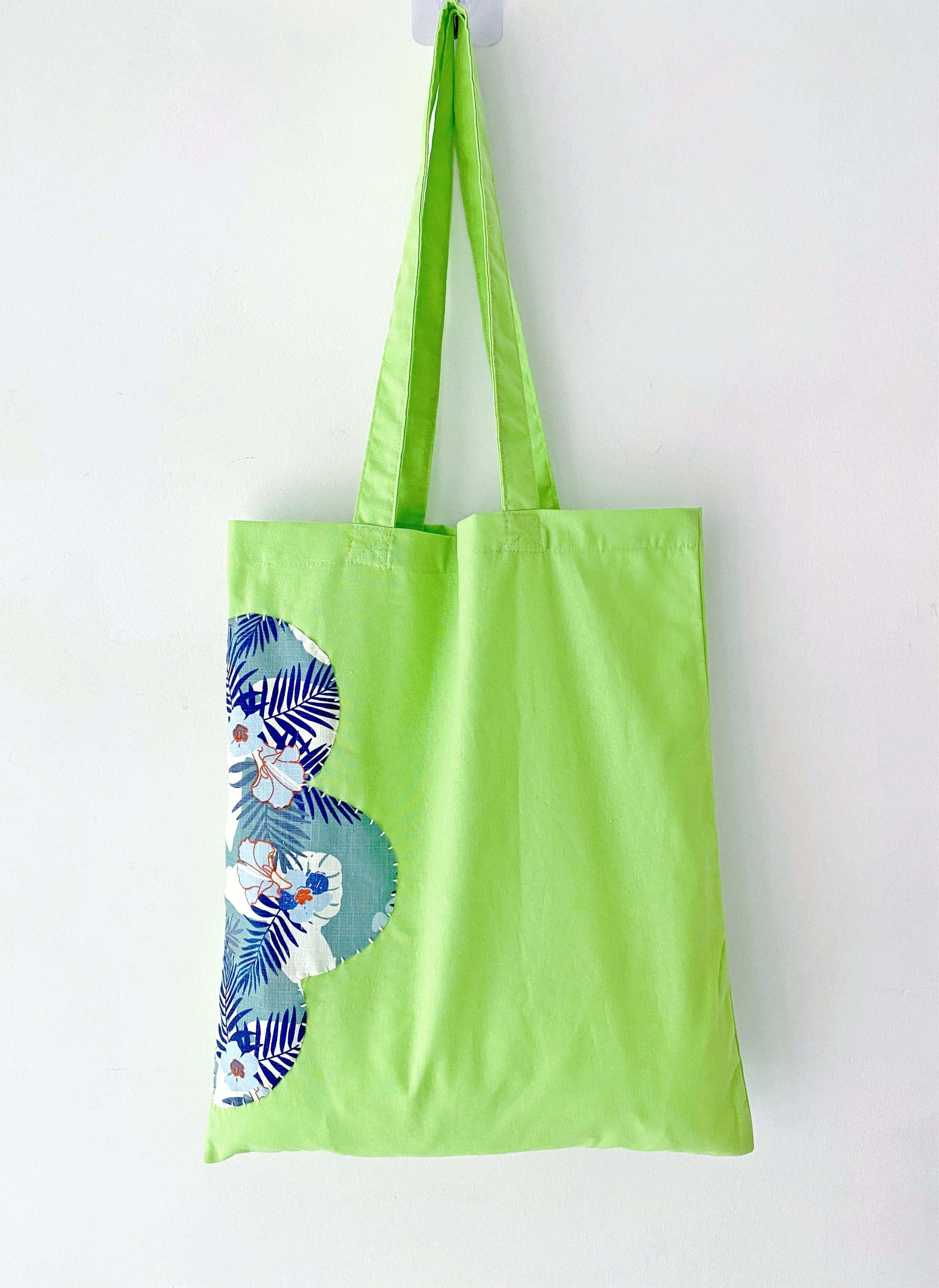 Relaxed style shoulder tote made from sustainable cotton, adorned with unique sewn patterns