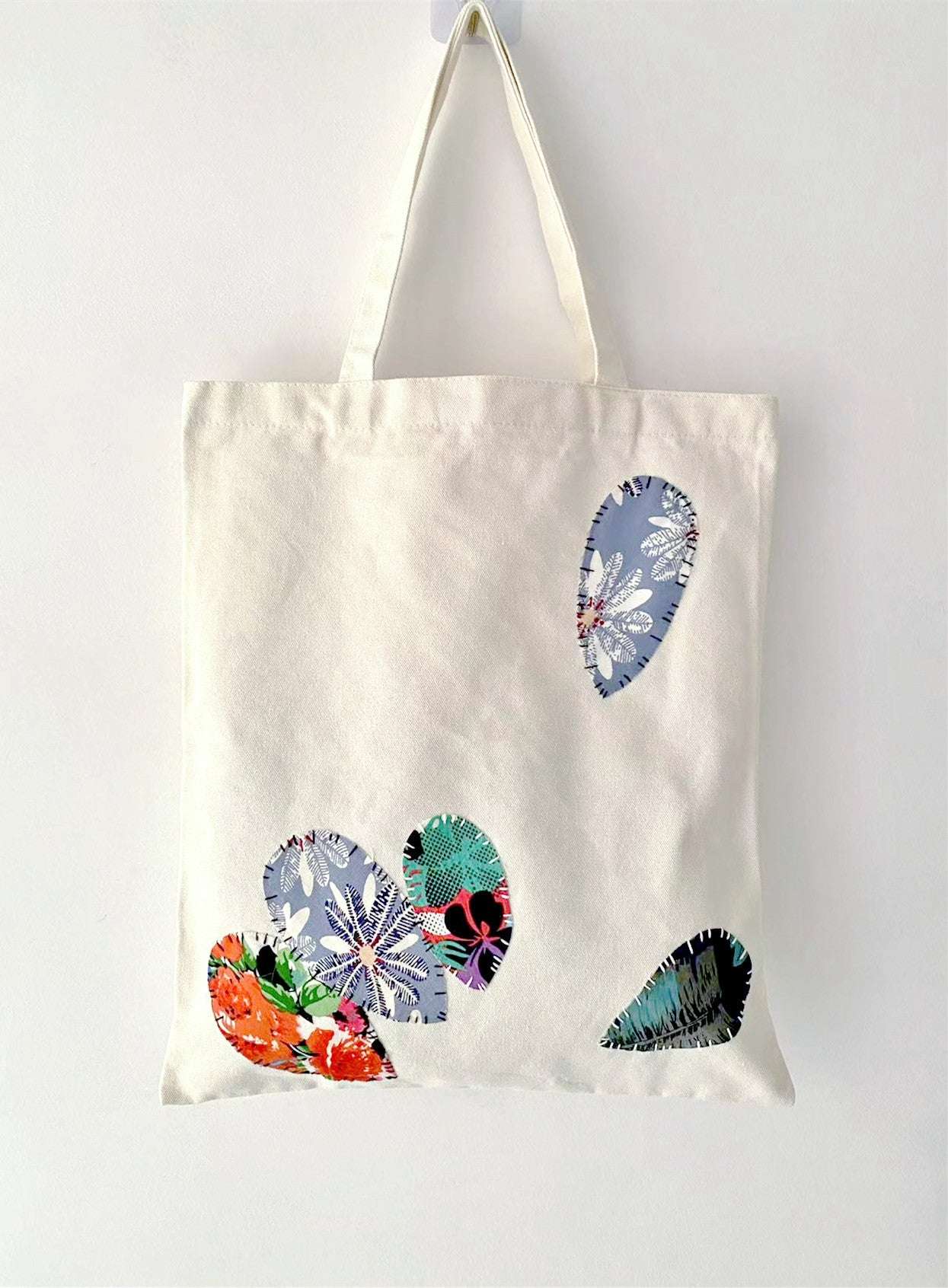 timeless canvas bag with subtle hand-sewn patchwork charm