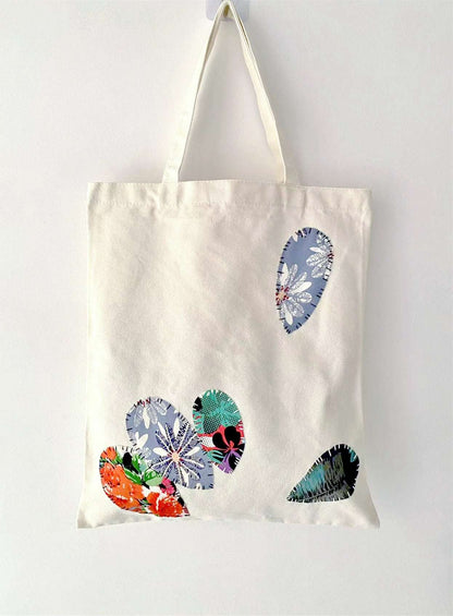 timeless canvas bag with subtle hand-sewn patchwork charm
