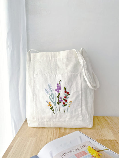 soft linen shoulder bag with hand embroidered floral design