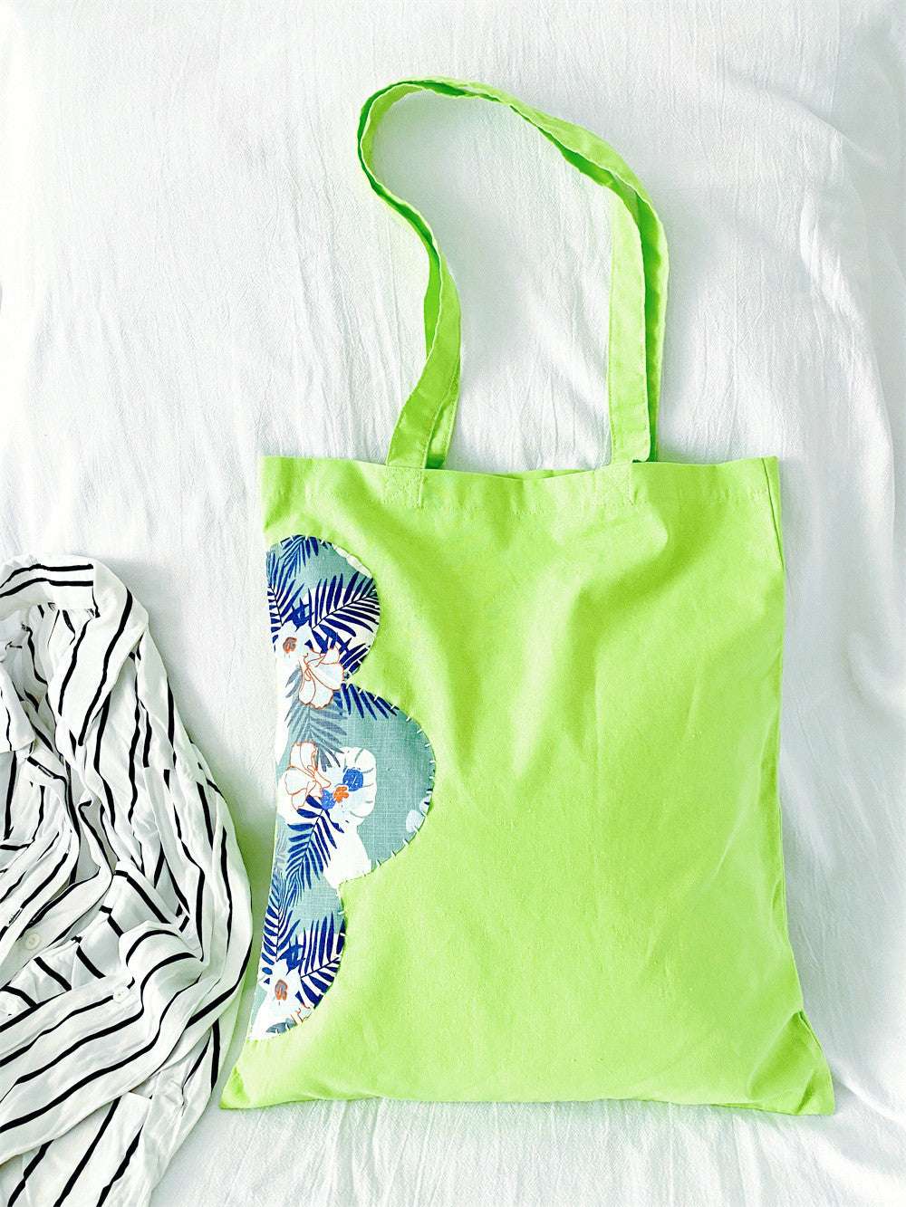 simple oversized tote bag with artistic hand-sewn charm