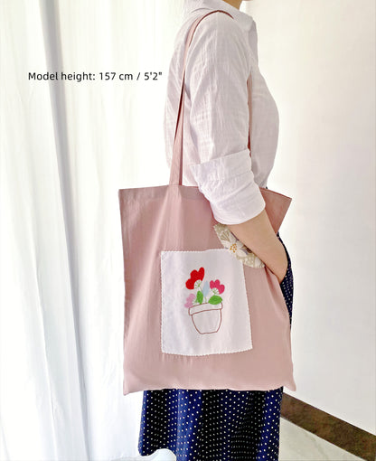 soft cotton tote bag with hand embroidered floral design for everyday use