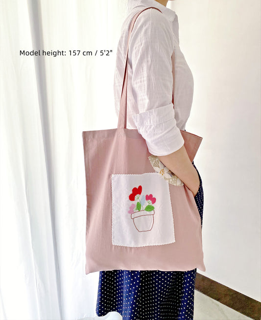soft cotton tote bag with hand embroidered floral design for everyday use