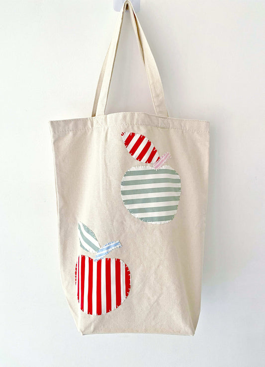 Sustainable large tote with hand-stitched patchwork, tailored for artistic souls seeking unique accessories