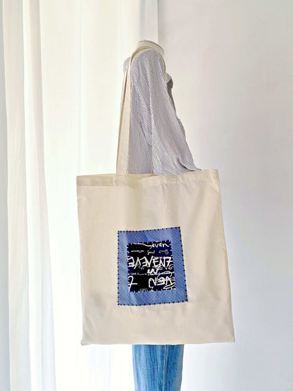 Creative lightweight tote in natural fabric, ideal for those seeking unique fashion statements