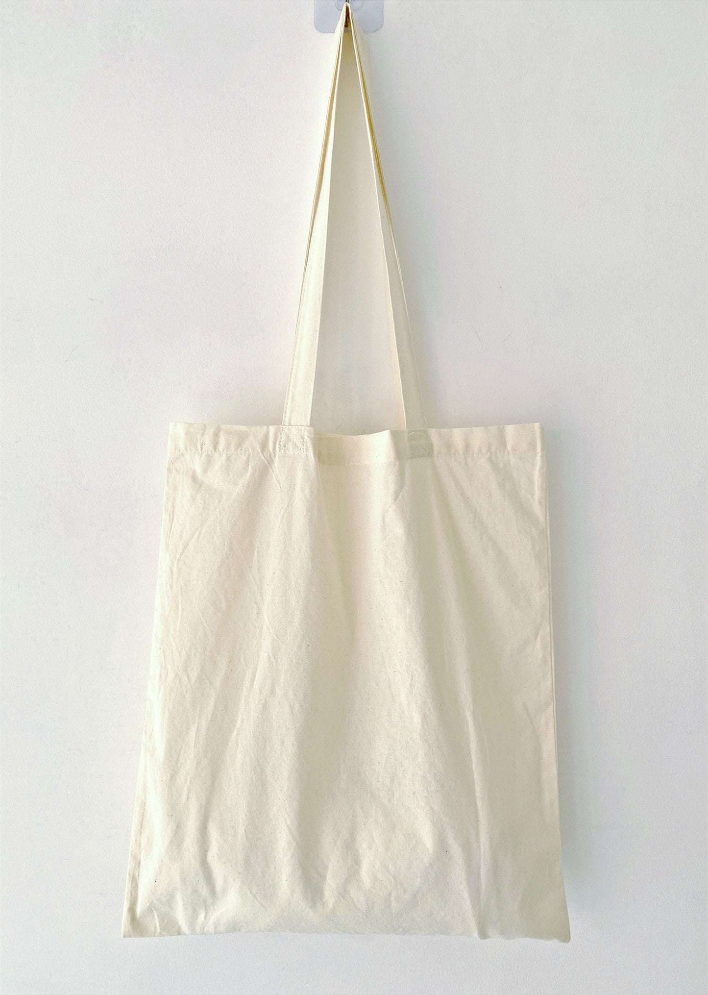 foldable cotton shopper that fits inside luggage for travel ease