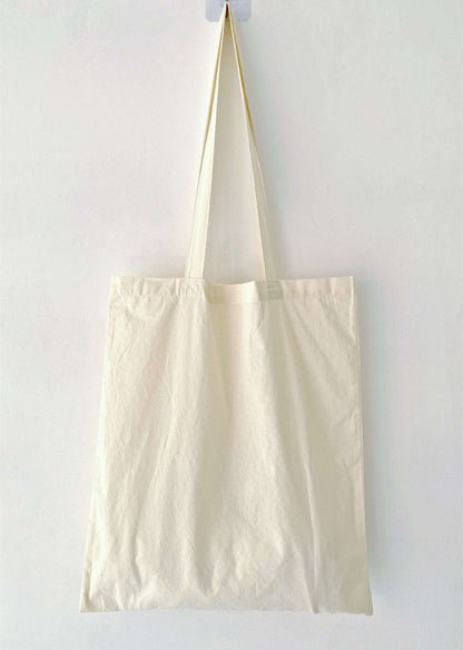 foldable cotton shopper that fits inside luggage for travel ease