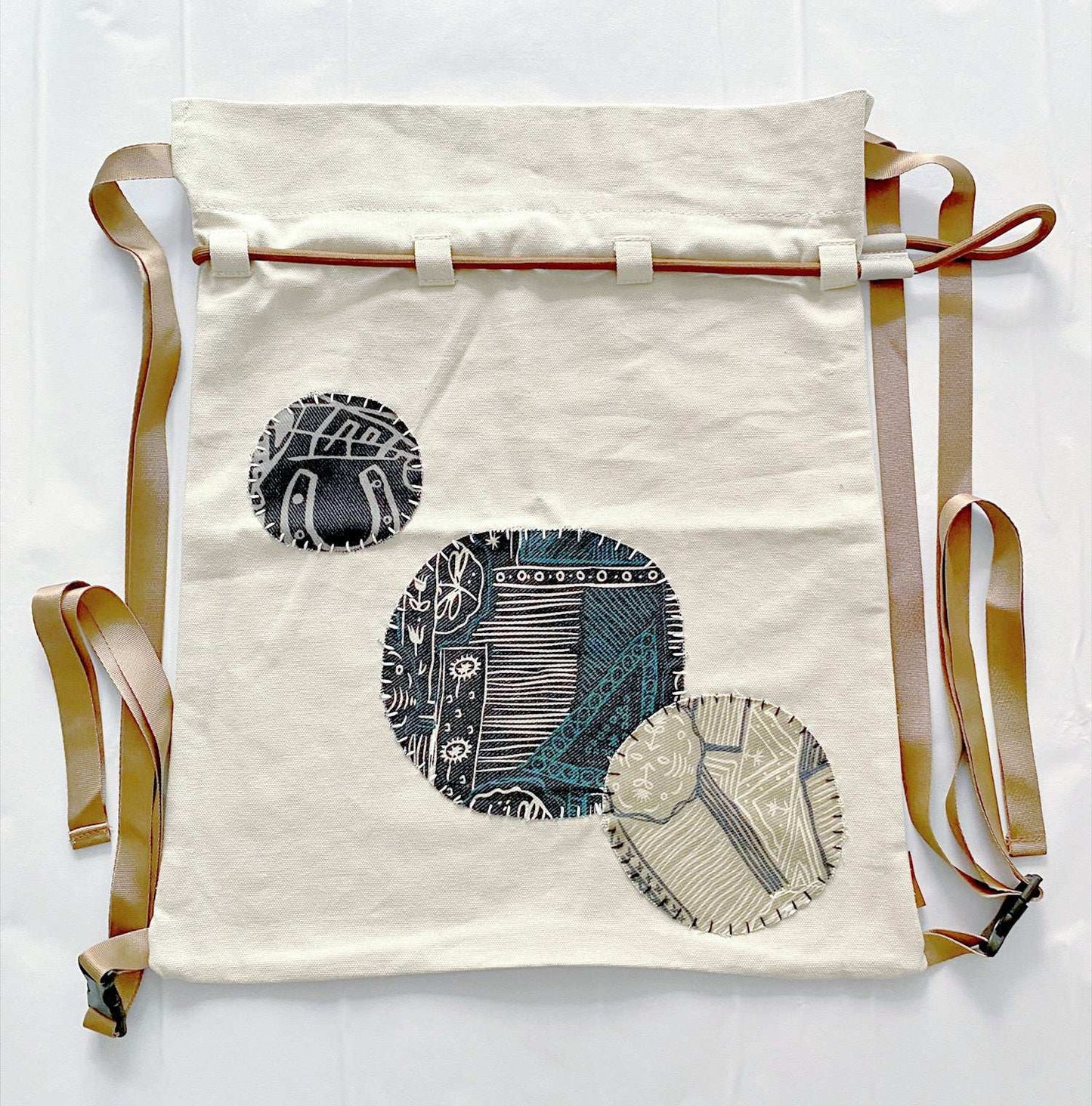 natural cotton backpack with artisanal patchwork embroidery accents