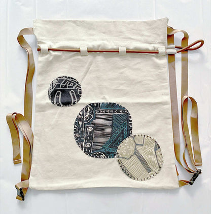 natural cotton backpack with artisanal patchwork embroidery accents