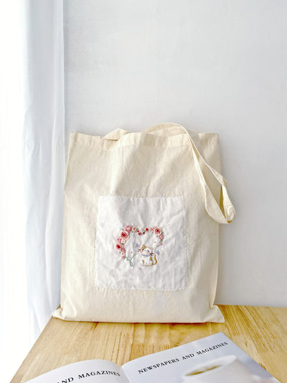 slow fashion cotton bag with unique hand stitched floral artwork