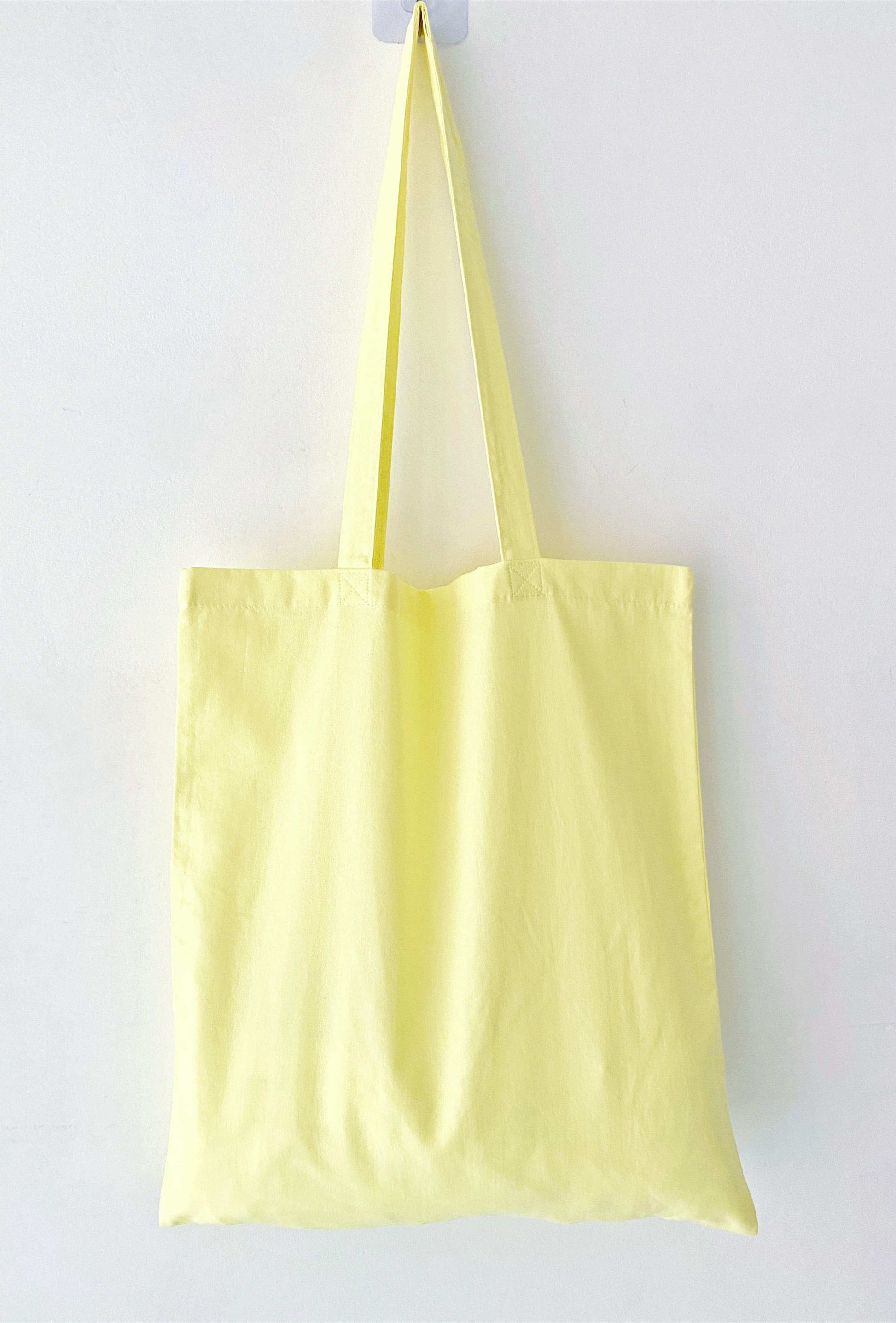 relaxed fit eco tote bag with unique handmade potted plant embroidery