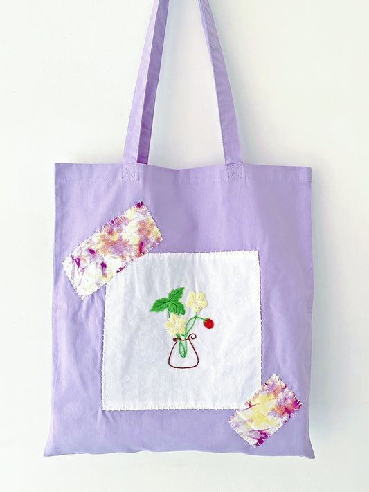 lightweight cotton tote with hand stitched flowers for spring outfit