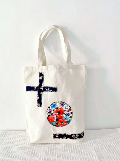 fashion forward women’s tote featuring stitched patchwork art