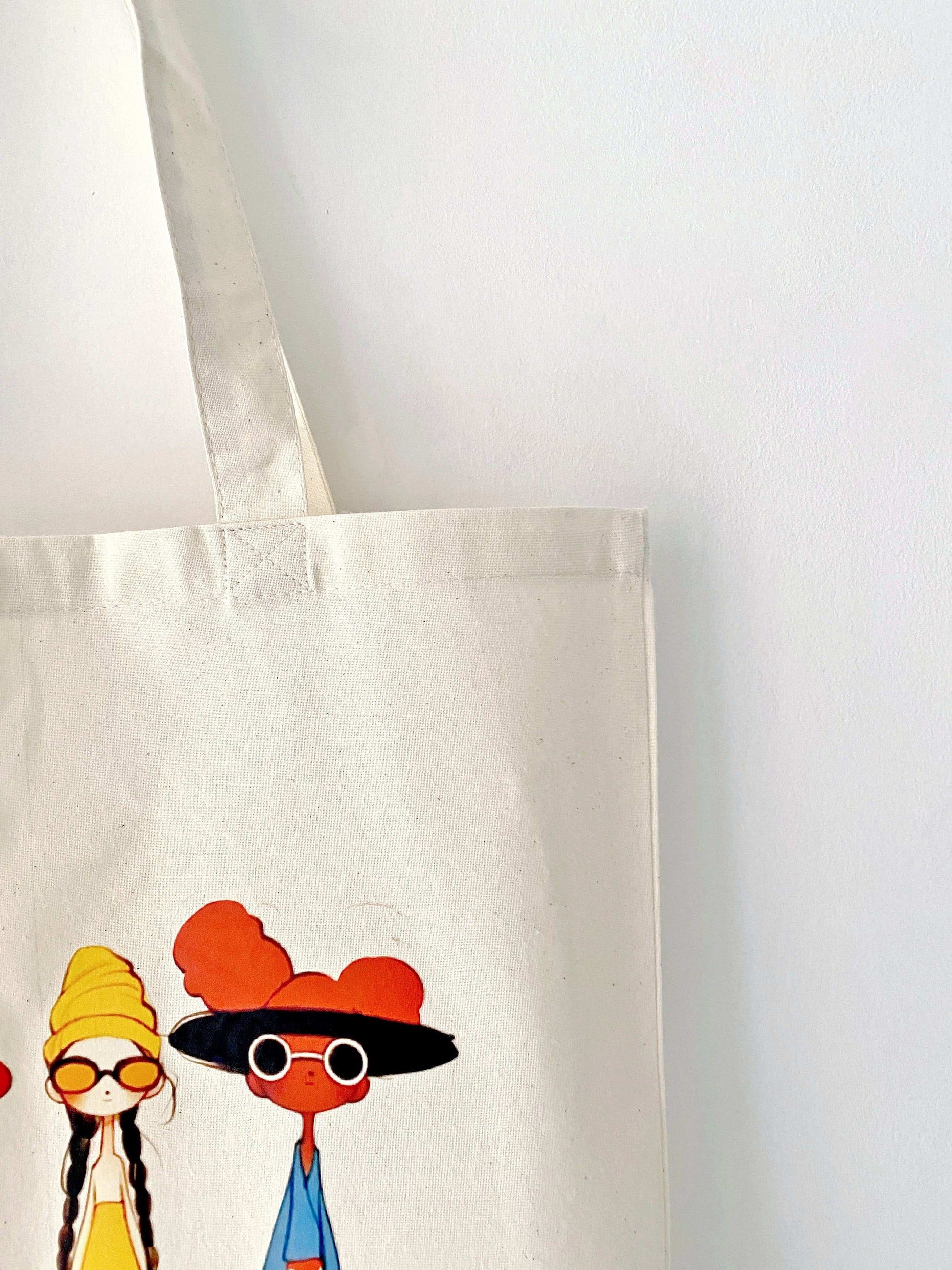 Hand-printed eco tote combining artistic charm and daily practicality.