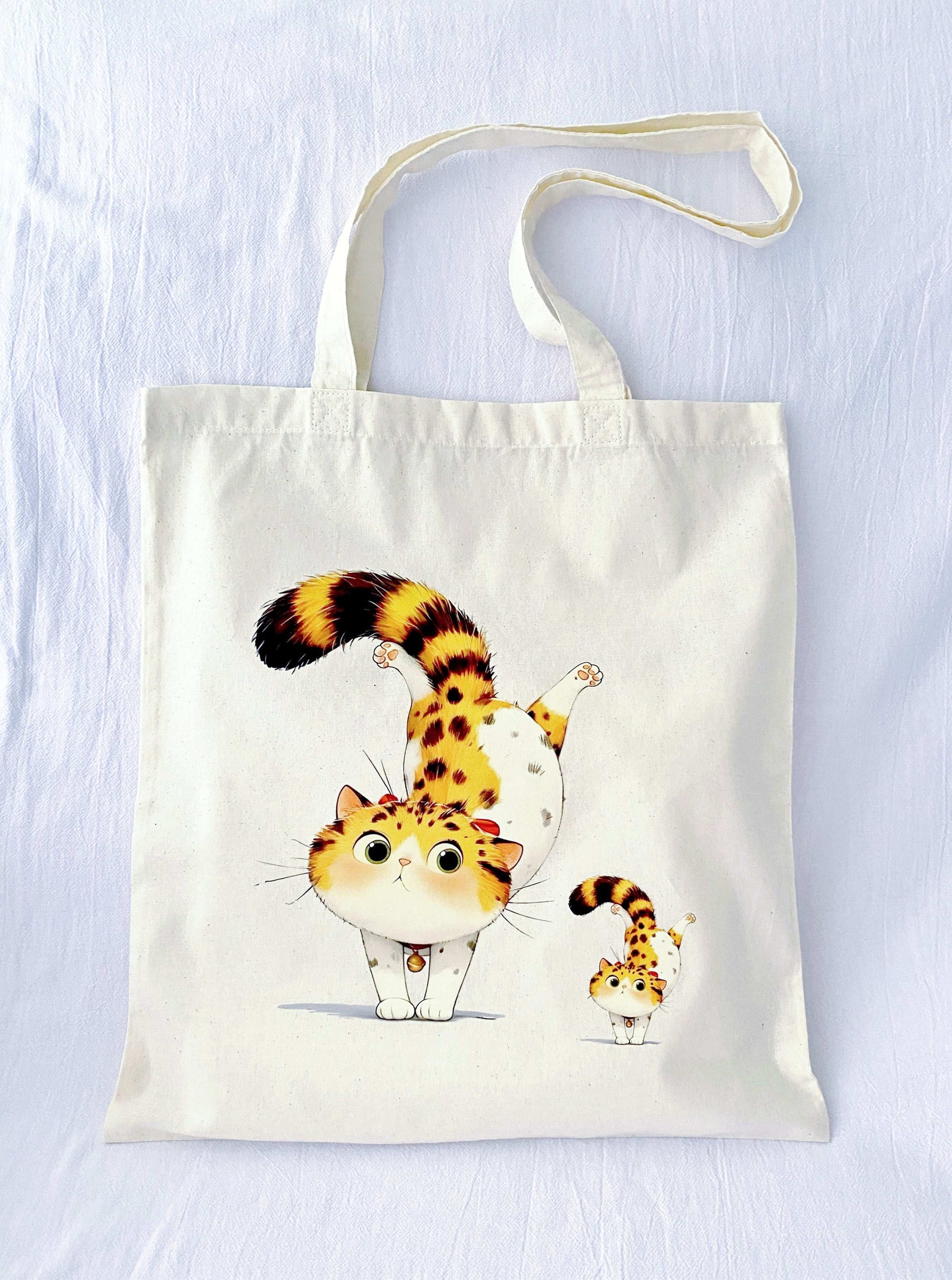 Soft and lightweight sustainable cotton shoulder bag featuring a cute cat print